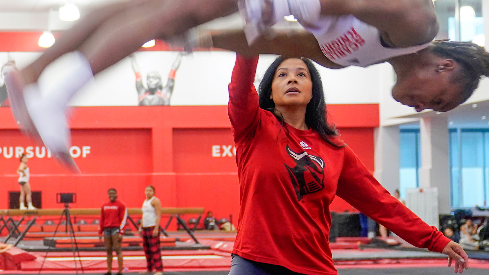 Rutgers gymnastics coach Umme Salim-Beasley advocates for change, inspired by her activist grandfather - Andscape