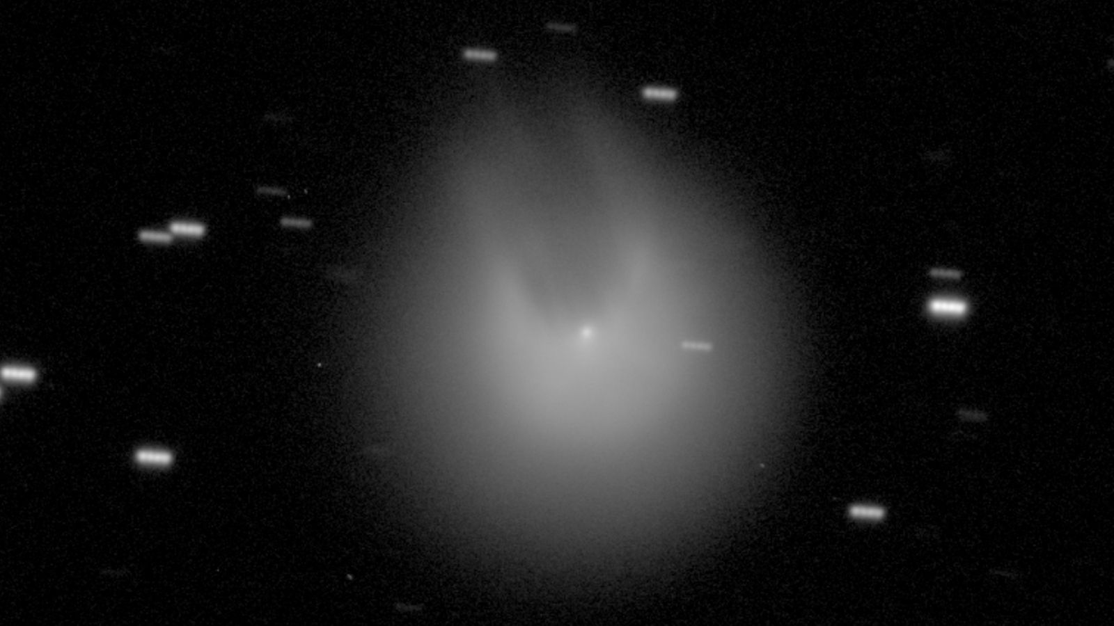 City-size comet headed toward Earth 'grows horns' after massive volcanic eruption | Live Science