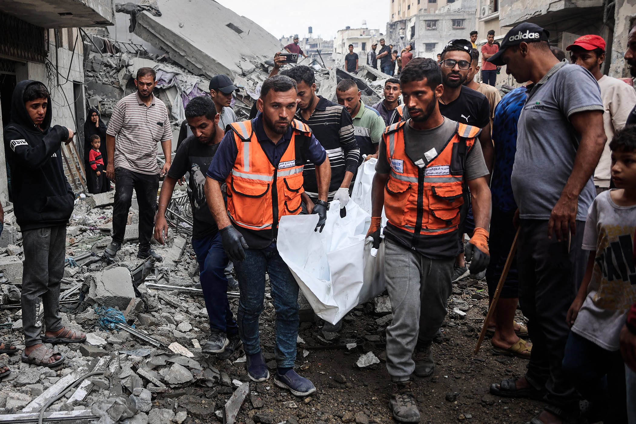 In the mass grave of Gaza, families dig for their loved o...