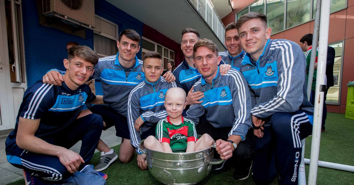 Pictured: All-Ireland champions Dublin visit Our Lady's Children's Hospital in Crumlin - Irish Mirror