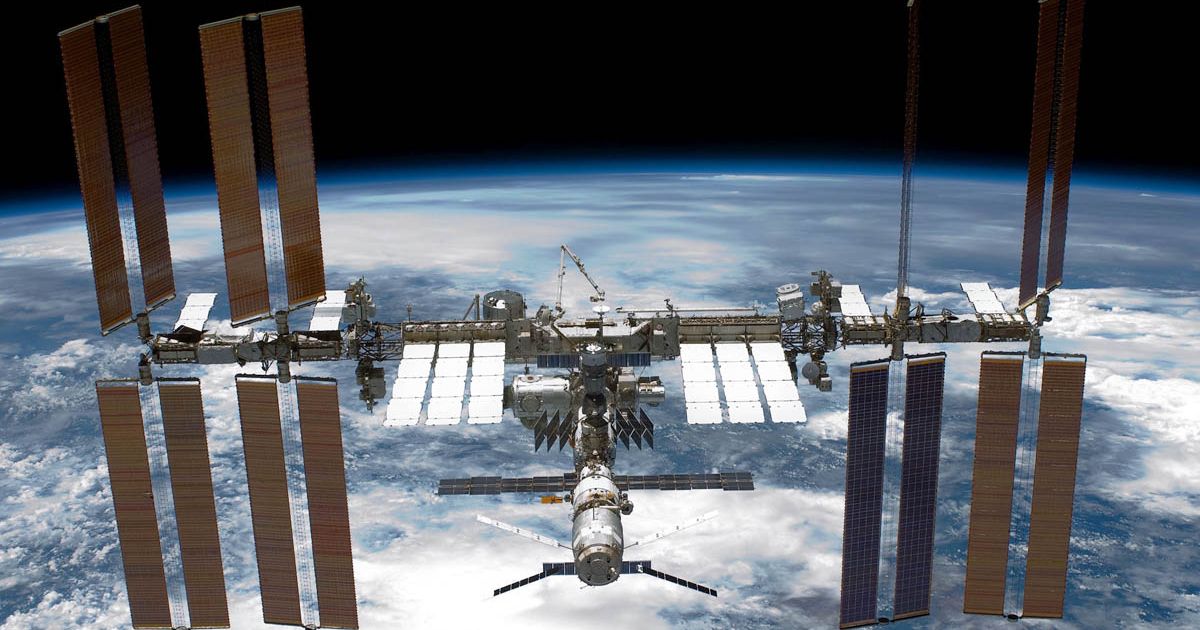 Incredible International Space Station photo reveals huge meteor crater illuminated by stunning aurora light show - The Mirror