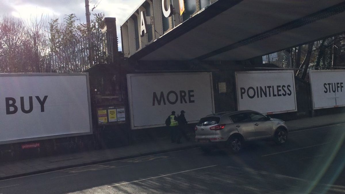 Mystery surrounds 'Buy More Pointless Stuff' advertising board in Ealing - My London