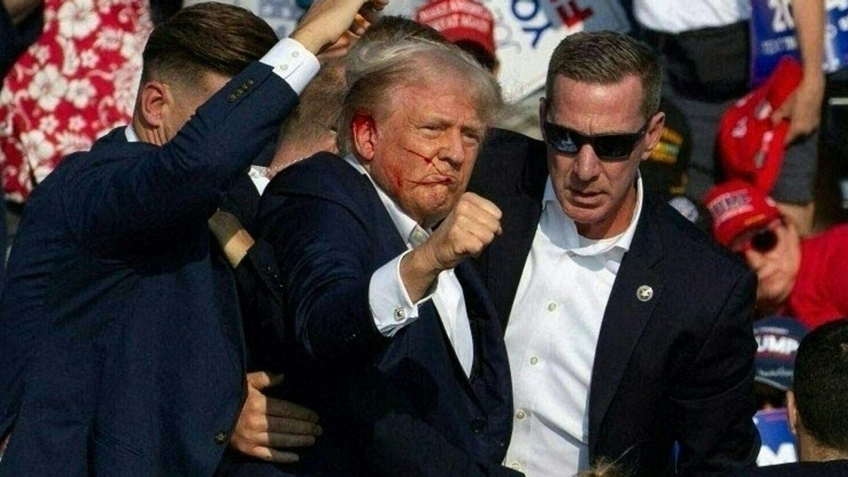Chilling footage shows Donald Trump's shooter lying dead on roof at rally - The Mirror US