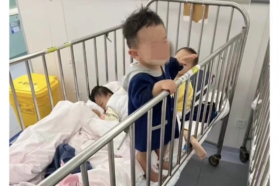 Shanghai Under Fire for Separating Infant Covid Patients From Their Parents - Caixin Global