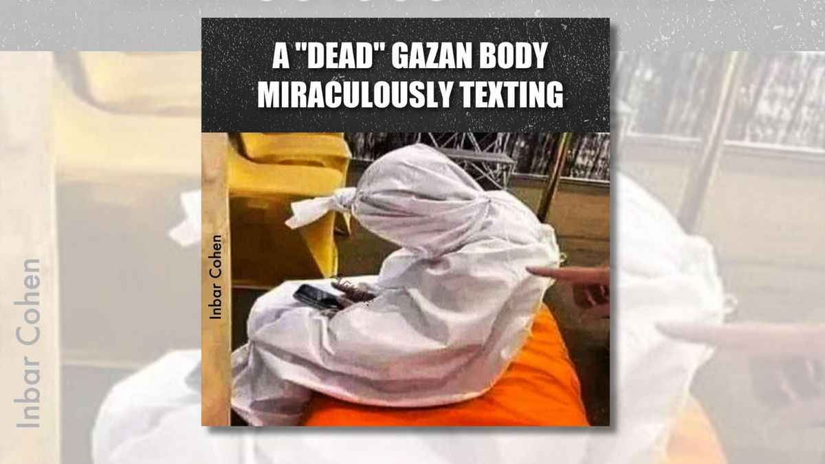 Does This Photo Show a 'Dead Gazan Body' Miraculously Texting from Inside a Body Bag? | Snopes.com