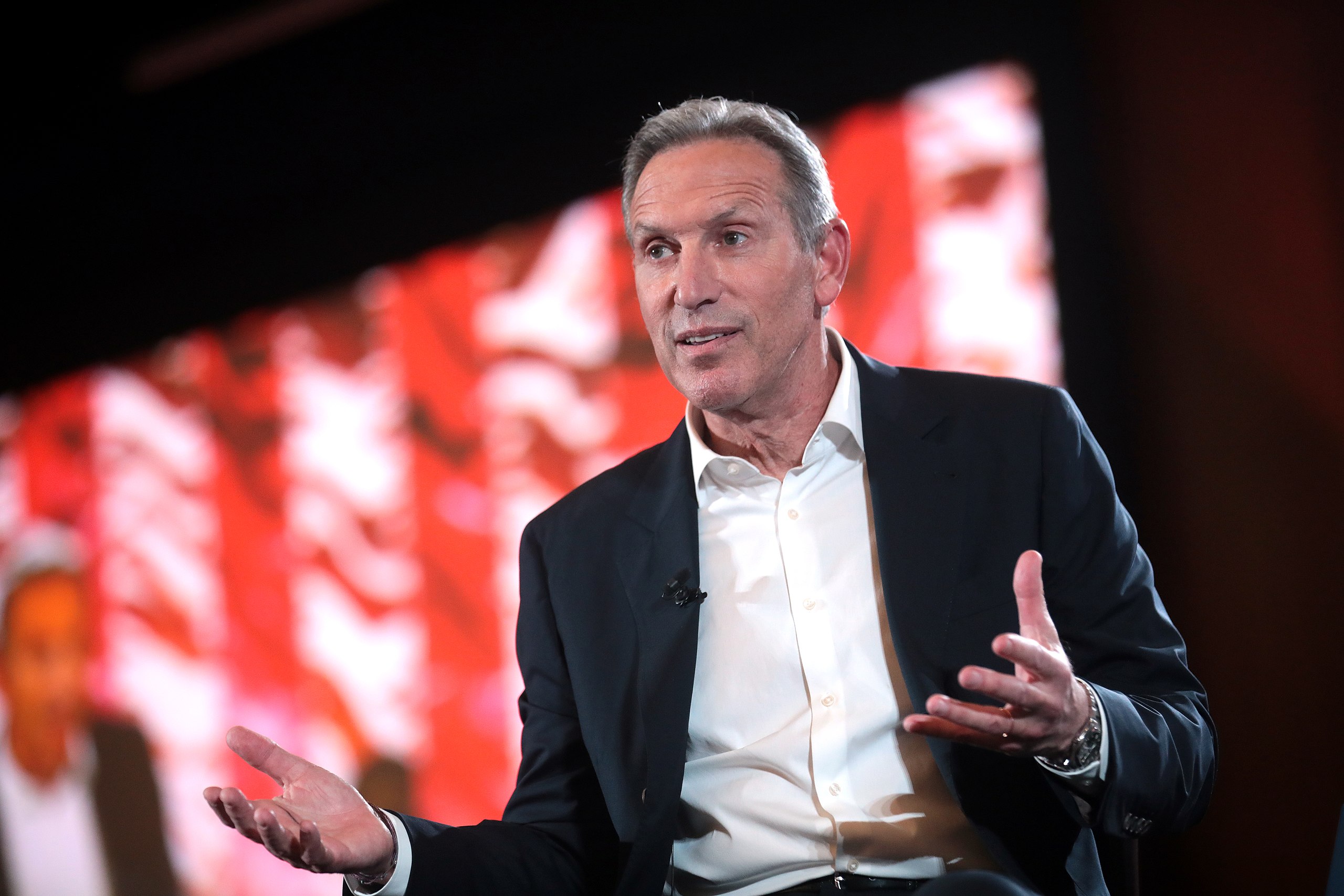 Starbucks Barista Challenges CEO Howard Schultz At Airport Meeting