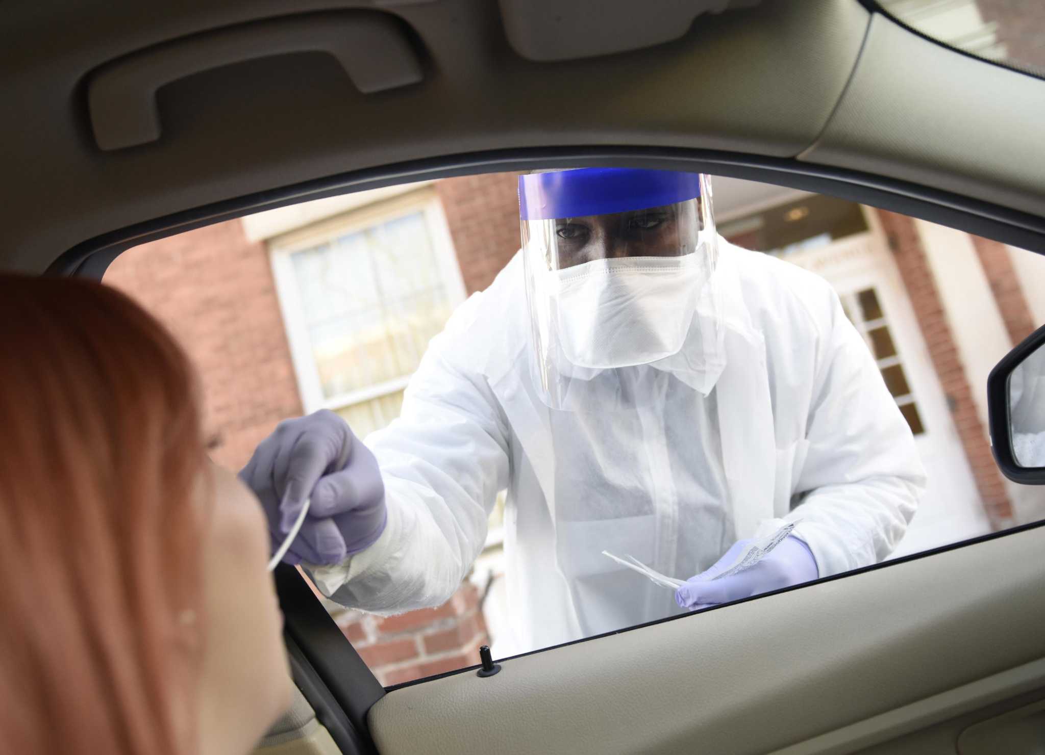 Local medical service tests patients for coronavirus from their cars