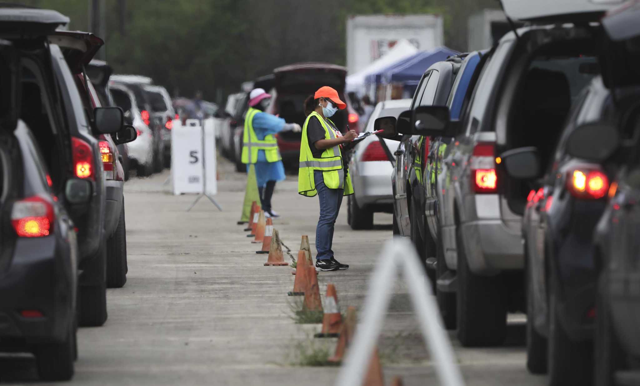 S.A. Food Bank giveaway draws a queue of cars stretching miles