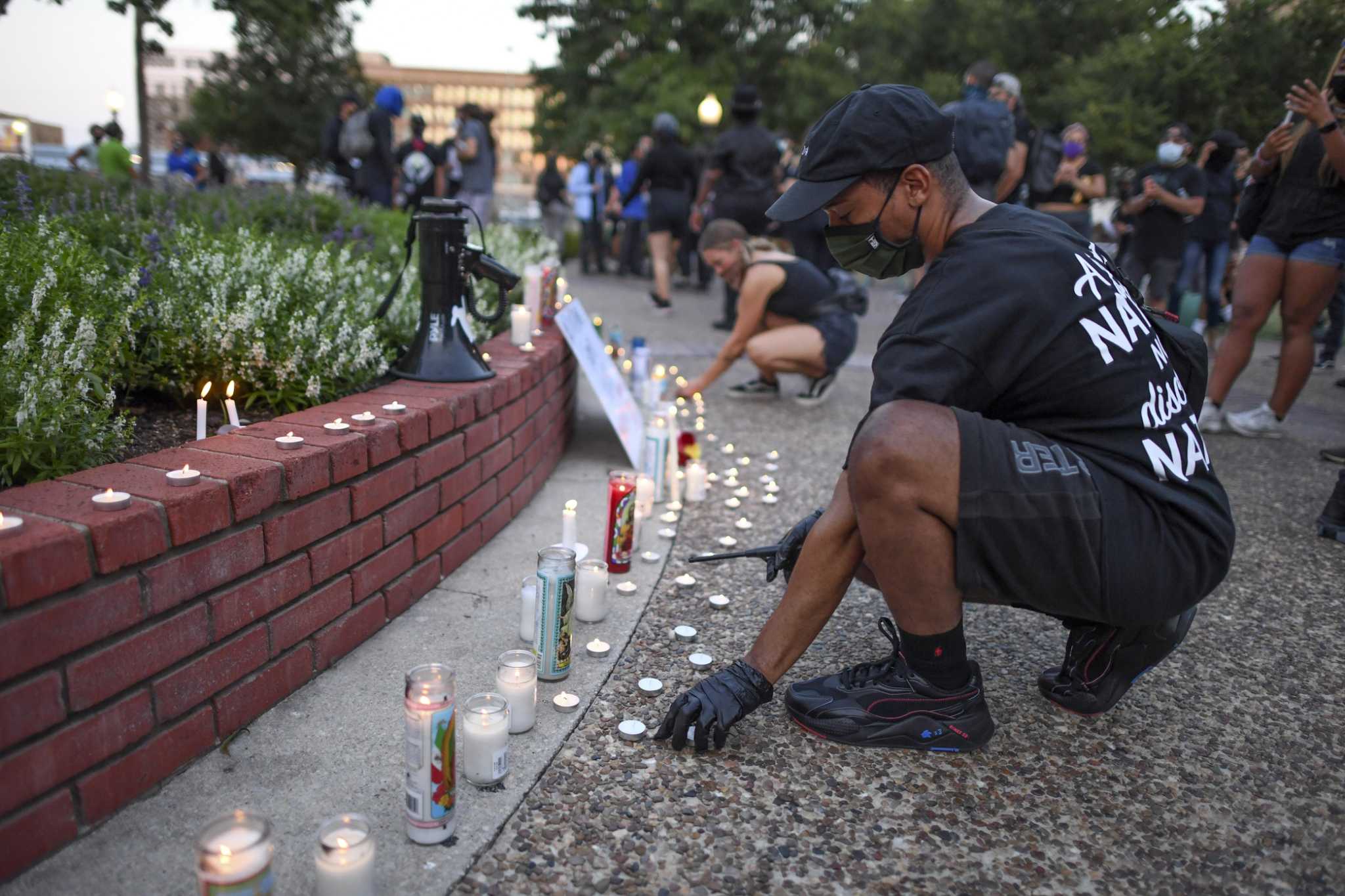 Austin, local activists share memories of slain protester at downtown memorial