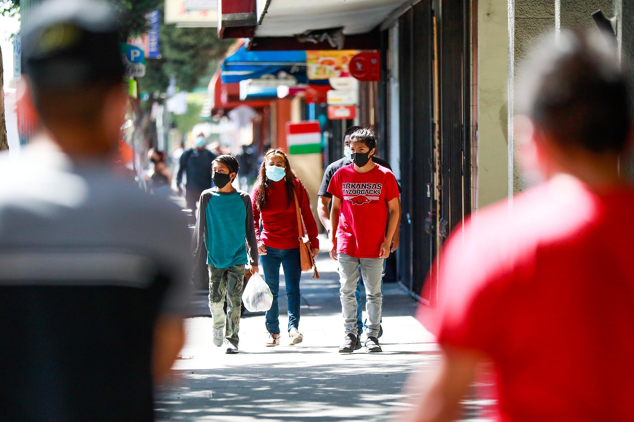 One Oakland neighborhood has seen a surge in positivity rates among Latino and Indigenous populations. Why?