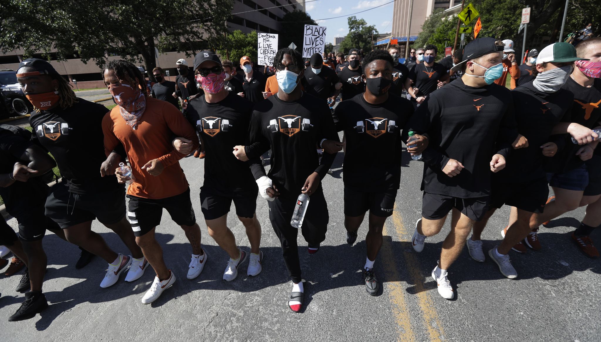 Texas coach Tom Herman, Longhorn football players march to state capitol in honor of George Floyd
