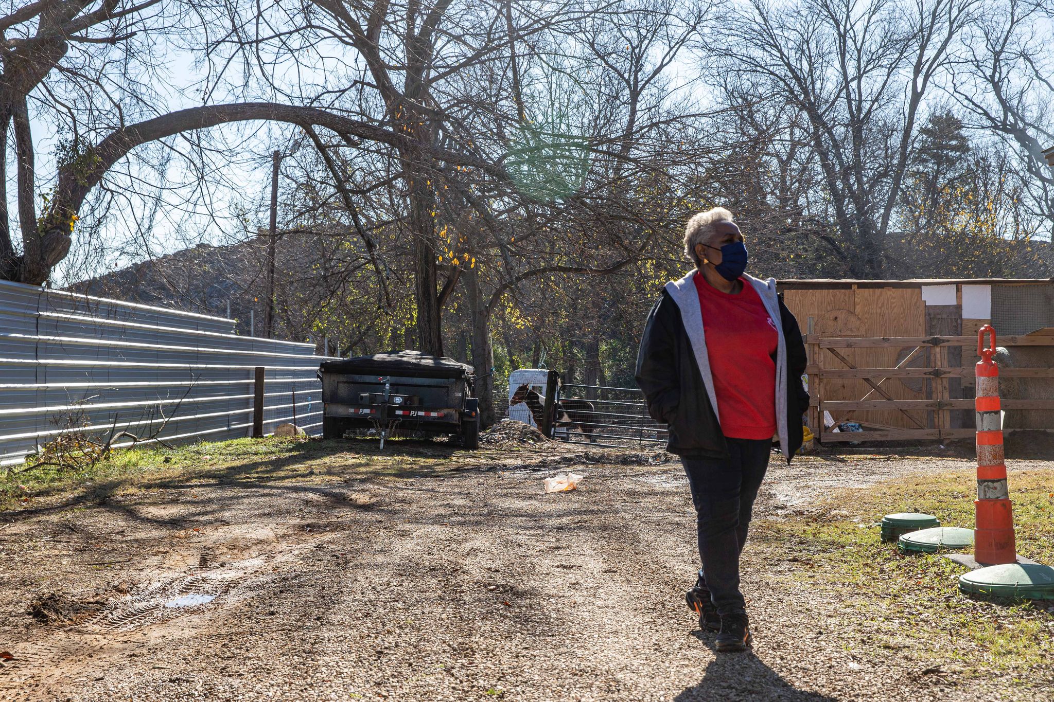 Finally: Southeast Dallas neighbors watch as trucks begin to haul off Shingle Mountain