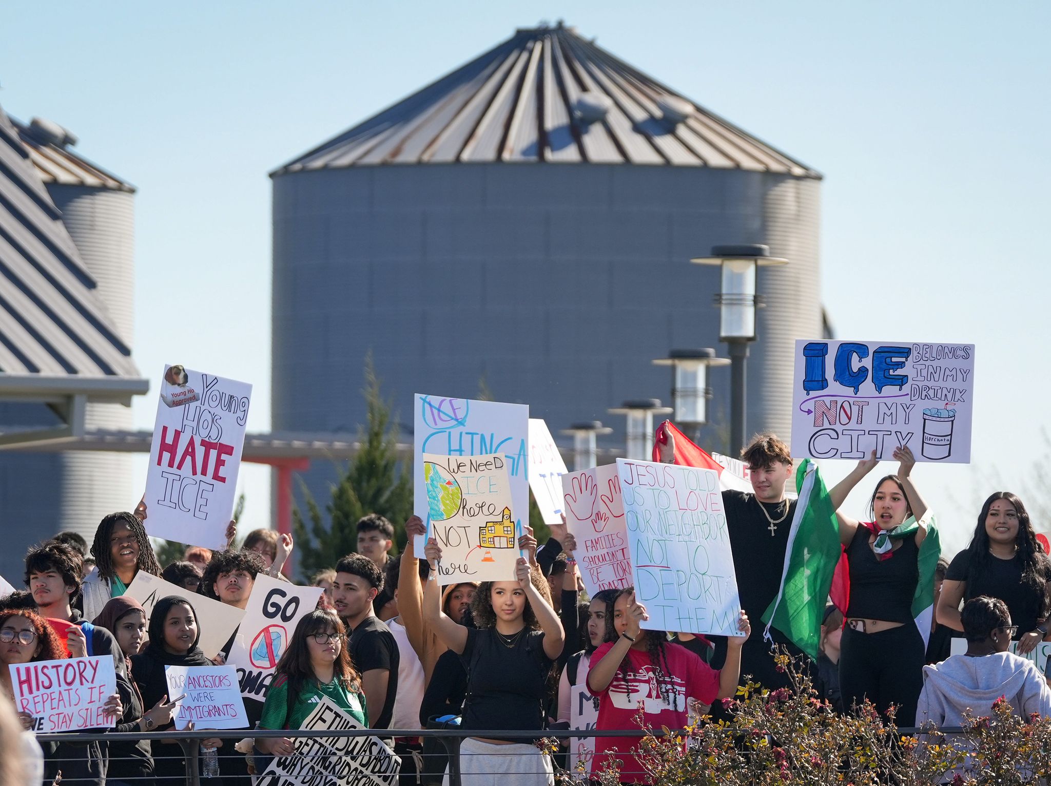 Students protest ICE at Hutto High School, see photos from walkout