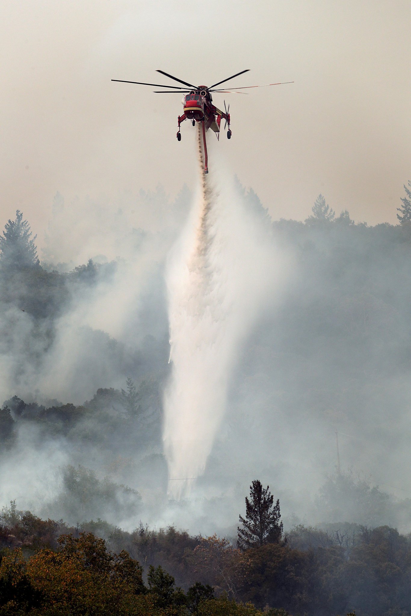 Firefighters carve lines around N. Calif. wildfires as death toll goes to 35