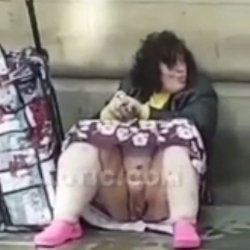 Homeless woman sitting outside