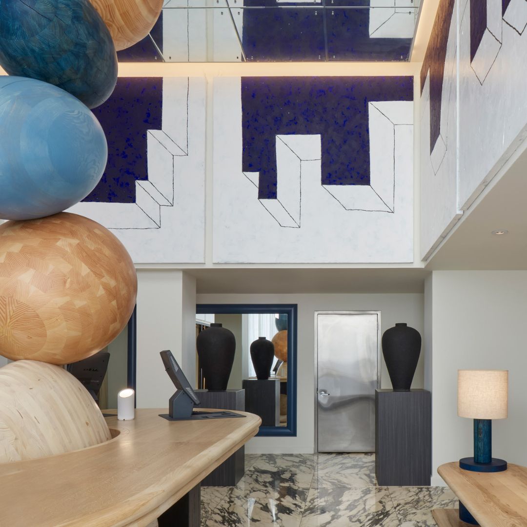 Jan Hendzel designs towering timber sculpture for Hotel Park Ave