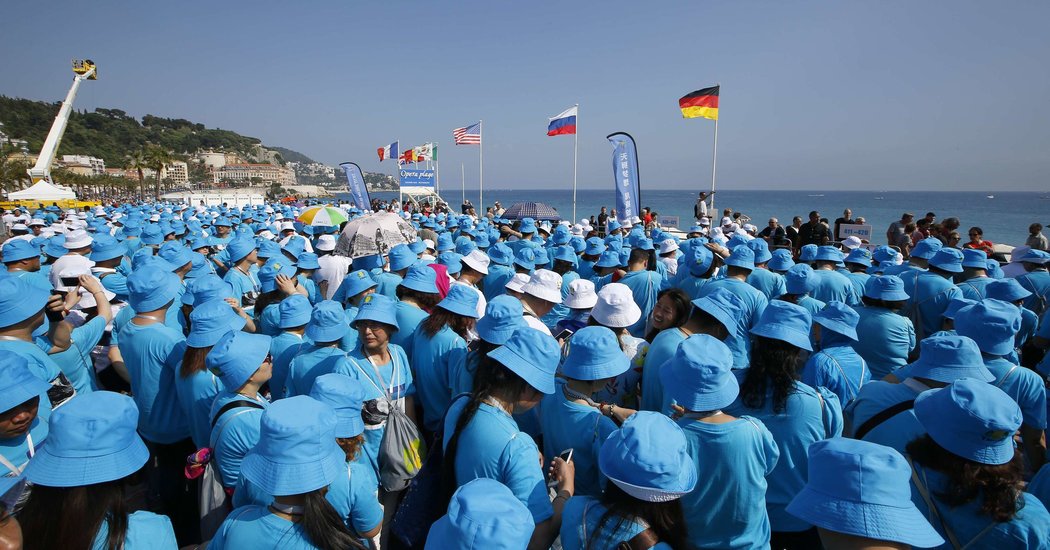 Chinese Billionaire Takes Over 6,000 Employees on a Trip to France - The New York Times