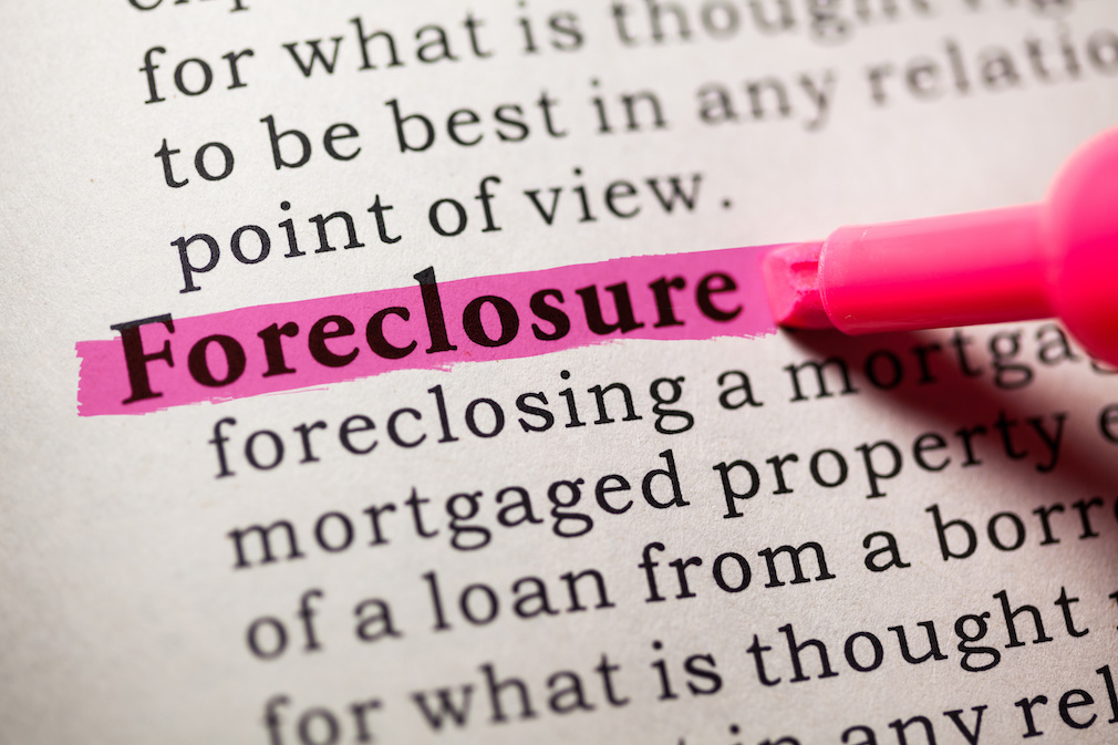Mortgage servicers sign $26 billion foreclosure settlement
