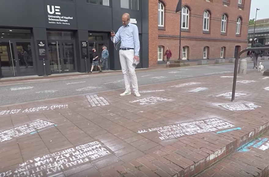 Twitter failed to delete some anti-Semitic posts. So this satirist spray-painted them on its German headquarters. - Jewish Telegraphic Agency