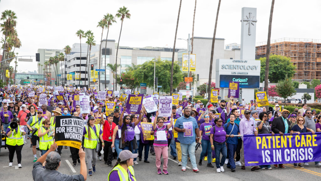Why are Kaiser Permanente staff considering a strike?